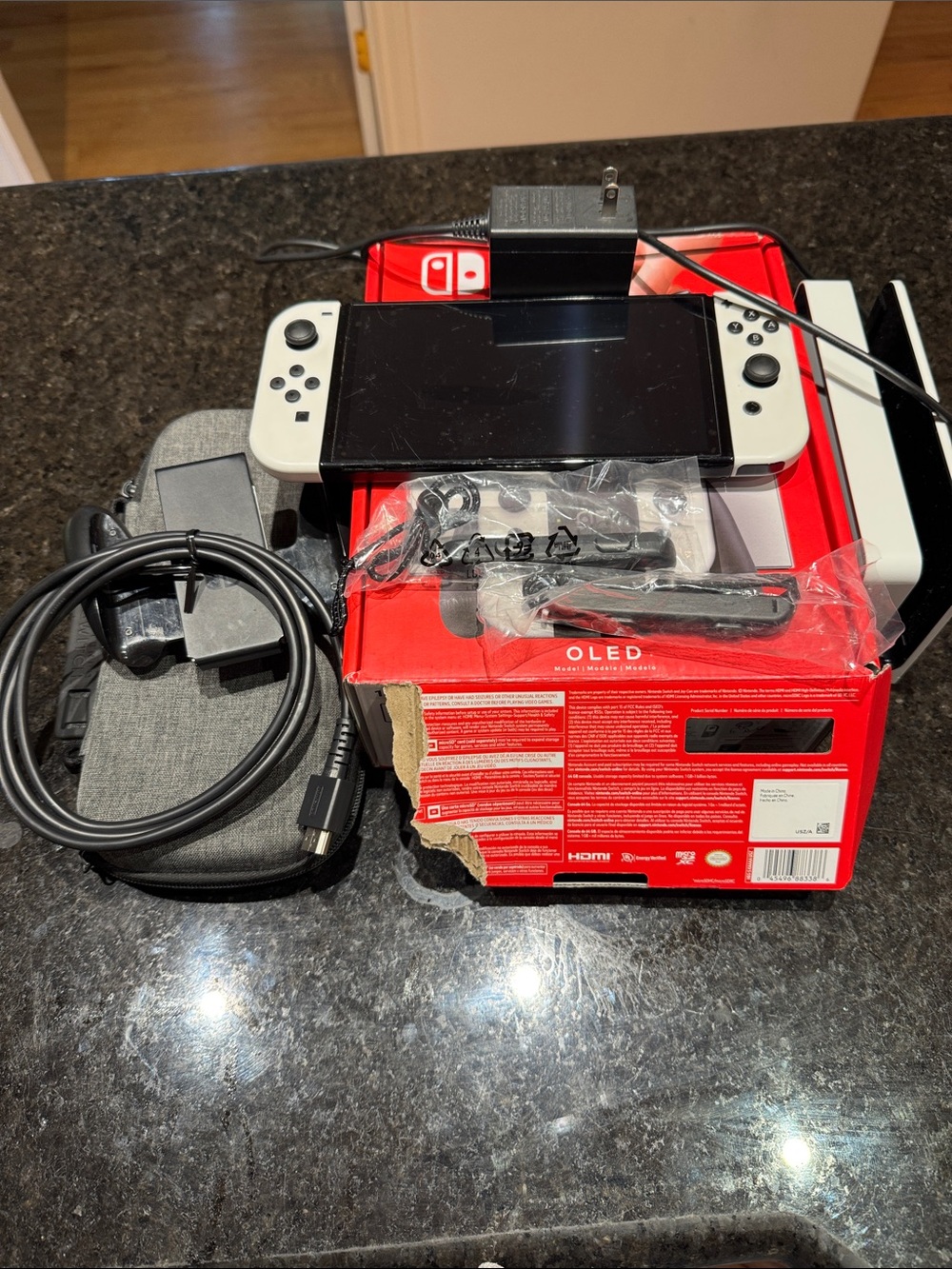 Nintendo Switch OLED Console with White Joy‑Con and Red Box